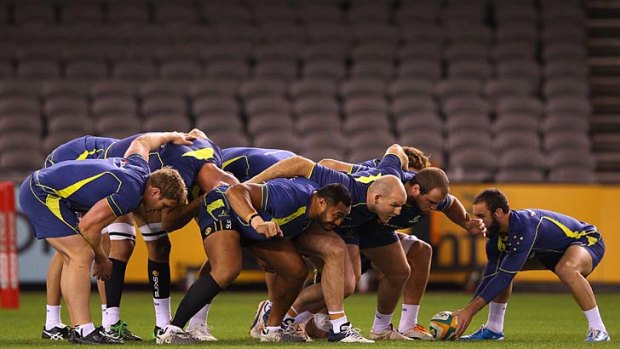 The Wallabies pack down during a training session yesterday.