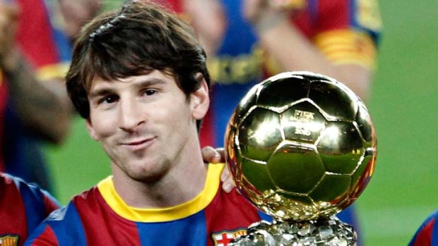 Lionel Messi poses with his Ballon d'Or trophy in January. Will he be handling another trophy at Wembley?
