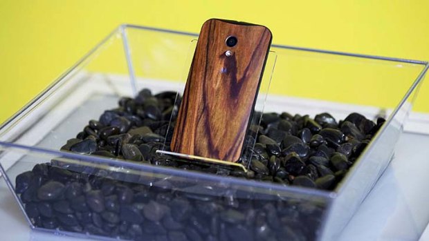 A Moto X with a wooden back.