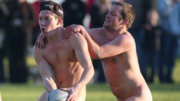 Nude students play rugby in Dunedin, New Zealand.