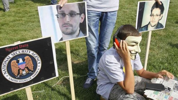 Listening posts: Activists rally in support of Edward Snowden in front of the US embassy in Kiev.