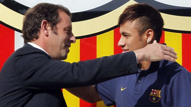 Neymar (R) with by Barcelona's former president Sandor Rosell.