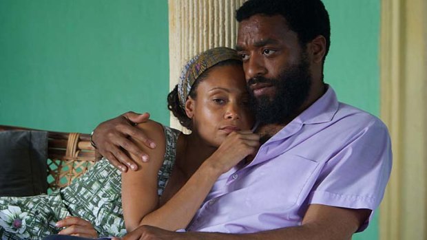 Turmoil threatens family life: Thandie Newton and Chiwetel Ejiofor tackle politics and relationships in director Biyi Bendele's civil war adaptation.
