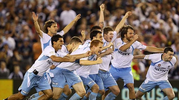 Sydney FC players celebrate after defeating Melbourne Victory and winning the A-League titla via a penalty shoot-out last year.