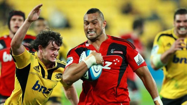 Untouchable ... Robbie Fruean breaks away from Richard Buckman on his way to scoring for the Crusaders.