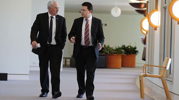 Senators John Madigan and Nick Xenophon have senators threatened to dump the plates, tea cups and saucers at the Prime Minister’s office on Thursday unless the gift is accepted.
