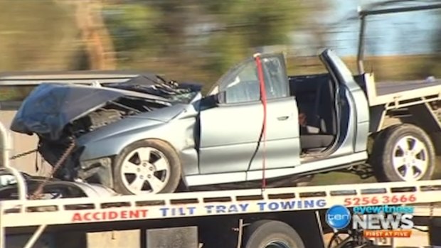 The ute is transported from the crash scene.