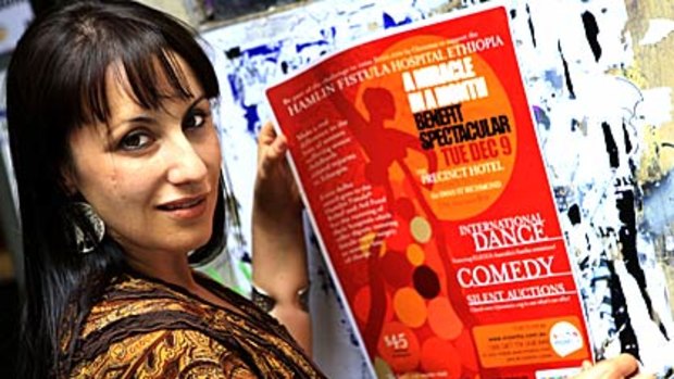 I realised I had to do something: Tania Sernia hangs a poster promoting her charity concert.