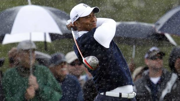 Pain in the rain ... Tiger Woods.