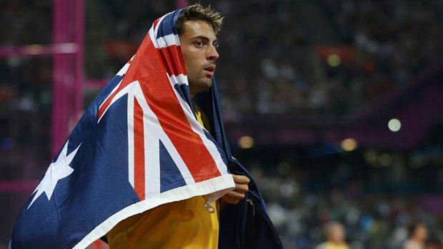 Australia's Mitchell Watt celebrates winning the silver medal in the men's long jump final.