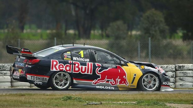 Jamie Whincup heads back to the pits after damaging his car in race 26.