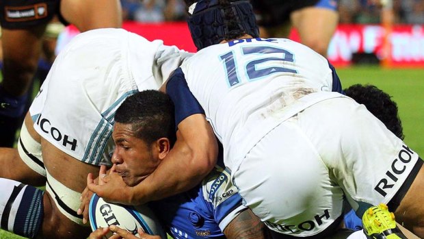 The Force's David Smith is tackled by Jerome Kaino and Benson Stanley.