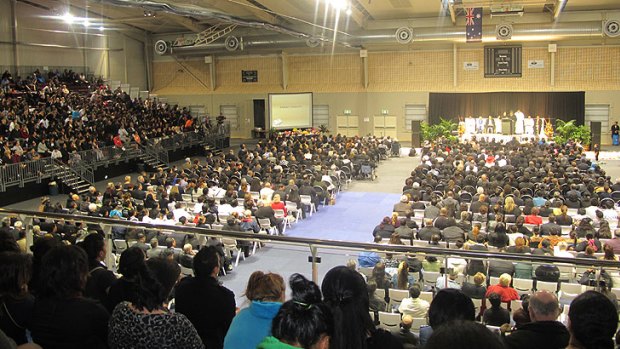 Four thousand mourners gather at a stadium at Crestmead, south of Brisbane.