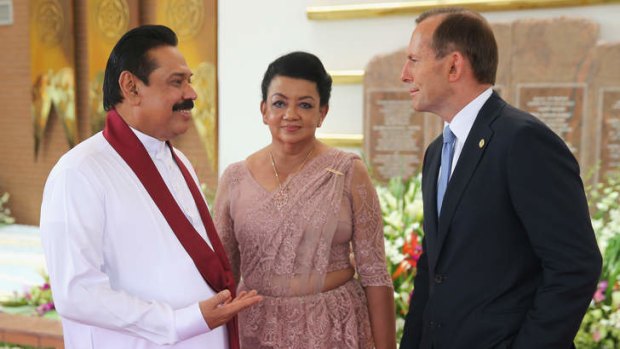 Prime Minister Tony Abbott speaks with Sri Lankan President Mahinda Rajapaksa. Australia has returned 41 asylum seekers to Sri Lankan custody despite Australia accusing the country of state-sponsored torture.