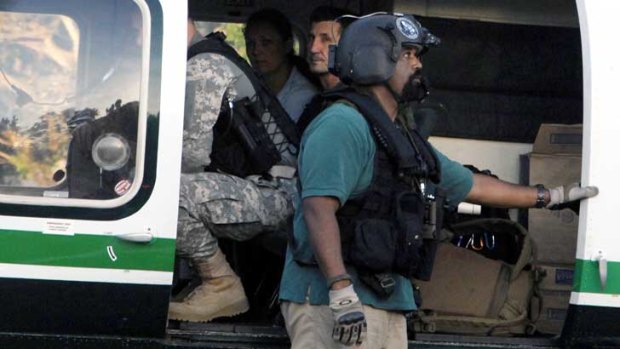 Rodwell with authorities in a helicopter.