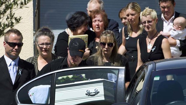 "In his short life he was so well loved" . . . the coffin of Baxtor Gowland, who died in the Christchurch earthquake, is taken to the cemetery.
