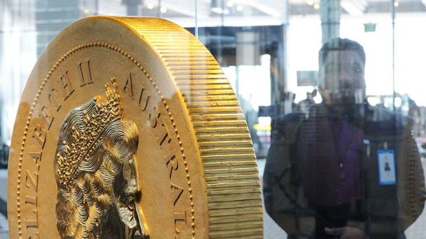 A security guard watches over the $1 million coin -- the biggest and heaviest in the world -- at the Commonwealth Heads of Government Meeting in Perth.
