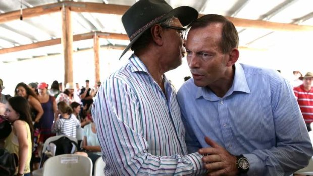 Warren Mundine talks with Tony Abbott during an election campaign visit to Arnhem Land.