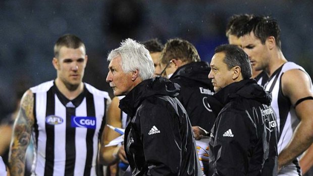 Master tactician: Collingwood coach Mick Malthouse issues instructions at the end of the first quarter against Port Adelaide.