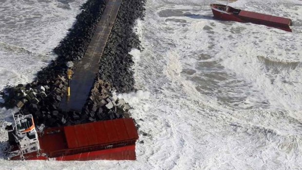 An aerial view show waves against a Spanish cargo ship carrying, broken in two, off the beach in Anglet on the Atlantic Coast of France.