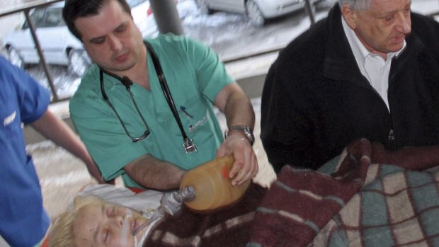 Medical staff assist Oksana Makar after the horrific attack in the town of Mykolayiv in southern Ukraine, as she is brought for treatment to a hospital in Donetsk on March 16.