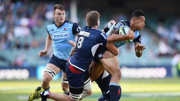 Game-breaker: Israel Folau runs at the Rebels defence in round six. 