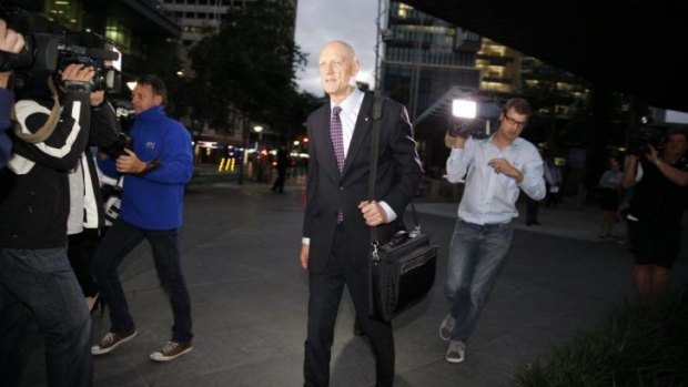 Peter Garrett leaves the home insulation inquiry in Brisbane.