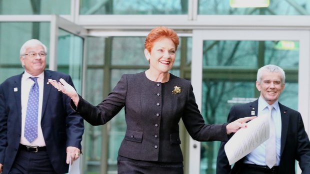 One Nation Senators Brian Burston, Pauline Hanson and Malcolm Roberts address the media during a press conference at Parliament House.