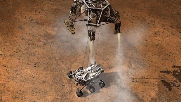This artist's concept depicts the moment that NASA's Curiosity rover touches down onto the Martian surface.
