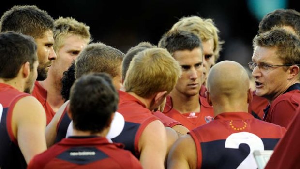 Melbourne in a huddle at their match against Hawthorn yesterday. The team was without Liam Jurrah.