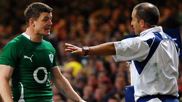 Ireland captain Brian O'Driscoll appeals to referee Jonathan Kaplan of South Africa after Mike Phillips of Wales scores a try in the corner.