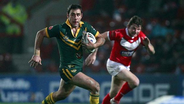 Tough challenge ... Australia's Cameron Smith, left, is chased by Wales' Lee Briers.
