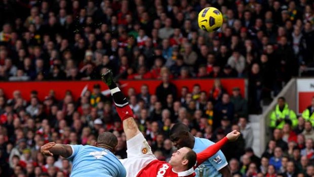Wonder goal ... Wayne Rooney of Manchester United scores the winner against cross-city rivals City.