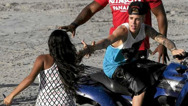 Canadian pop singer Justin Bieber greets a fan at a resort in Punta Chame on the outskirts of Panama City on January 27.