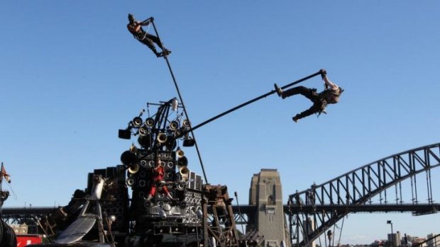 Live stunts: Warriors ride poles during the <i>Mad Max: Fury Road</i> show at Sydney Opera House.