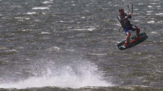 Kite surfers at Botany Bay made the most of heavy winds that hit Sydney on Sunday.