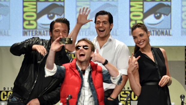 Moderator Chris Hardwick takes a selfie with actors Ben Affleck, Henry Cavill and Gal Gadot during Comic-Con in San Diego.