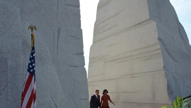 US President Barack Obama and First Lady Michelle Obama walk through the 'Mountain of Despair' at the dedication of the Martin Luther King Jr. Memorial.