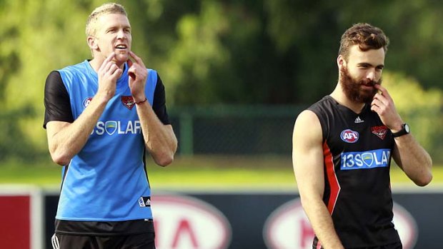 Essendon veteran Dustin Fletcher (left) compares his lack of facial hair with rookie Hal Hunter.