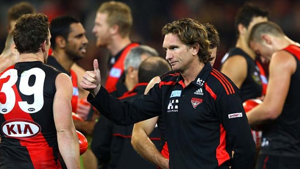 Thumbs up: Bomber coach James Hird shows his satisfaction after his side's win last night.