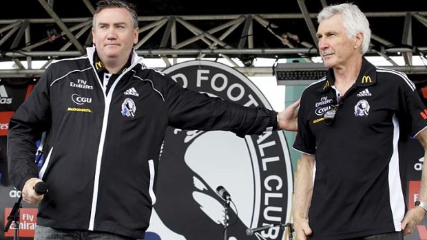 Collingwood president Eddie McGuire thanks outgoing coach Mick Malthouse on behalf of supporters who turned out in large numbers at Gosch's Paddock for the club's family day on October 2, 2011.