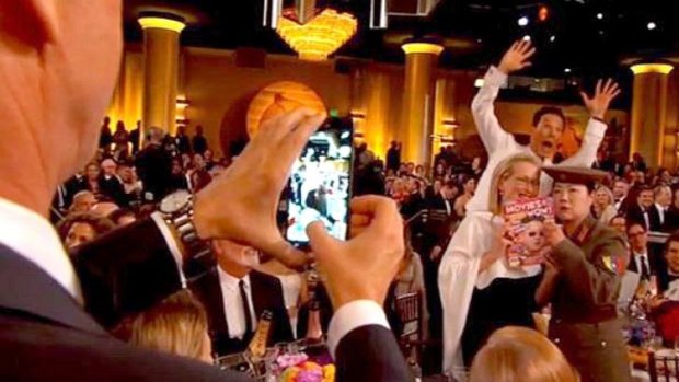 Cumberbatch photobombs Margaret Cho's Golden Globes gag.