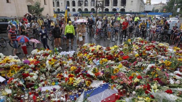 Tributes: A makeshift memorial for MH17 outside the Dutch embassy in Kiev.