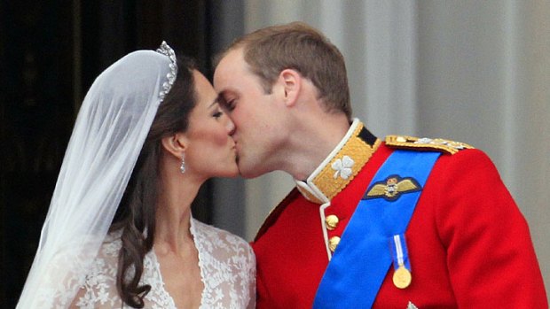 Britain's Prince William kisses his wife Kate, Duchess of Cambridge, on the balcony of Buckingham Palace after the Royal Wedding in London.