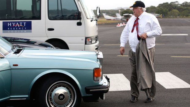 Clive Palmer arrivals in his own luxury vehicles.