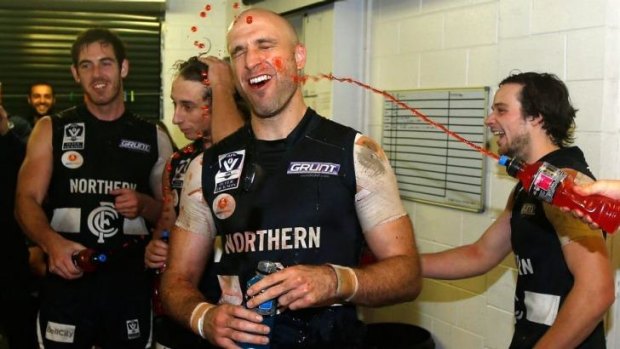 Chris Judd is showered in Powerade following his VFL debut