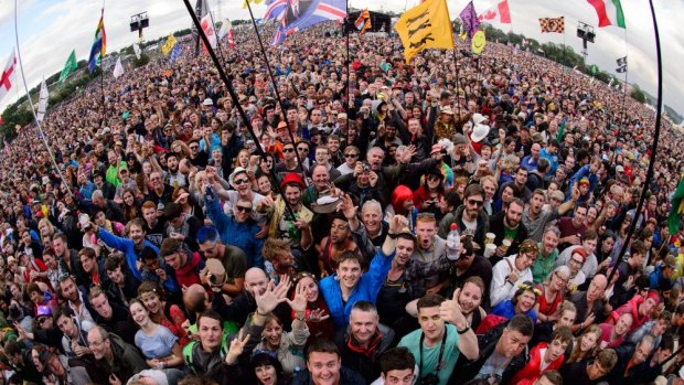 Fans wait for British band Elbow to perform on the Pyramid Stage on the first day of the Glastonbury Festival on Friday.