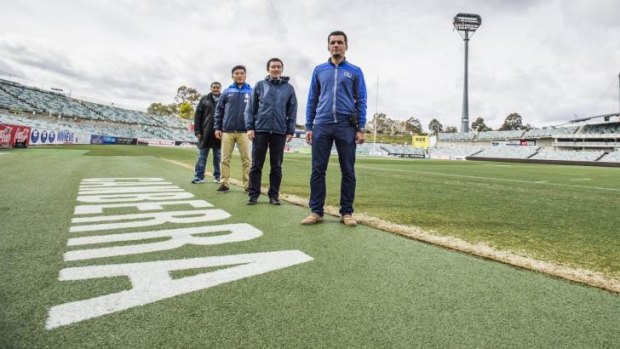 Delegates from Asian Cup teams: Oman Board member Saeed Baqaweer, Korean representative Ilki Park, Japan team administrator Naoki Tsumura and UAE coach Hassan Al Abdooli examining the Canberra Stadium surface.