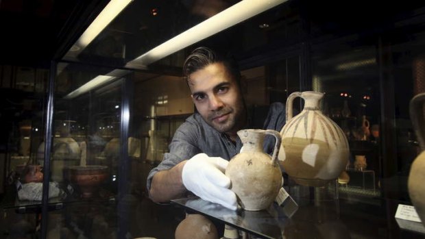 Handle with care: Aaron de Souza with Cypriot jugs and bowls in the Museum of Ancient Cultures at Macquarie University. He is a PhD student in the field of ancient Egyptian archaeology.