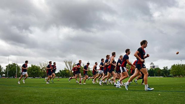 Dark times for the Demons: Melbourne players training this week.